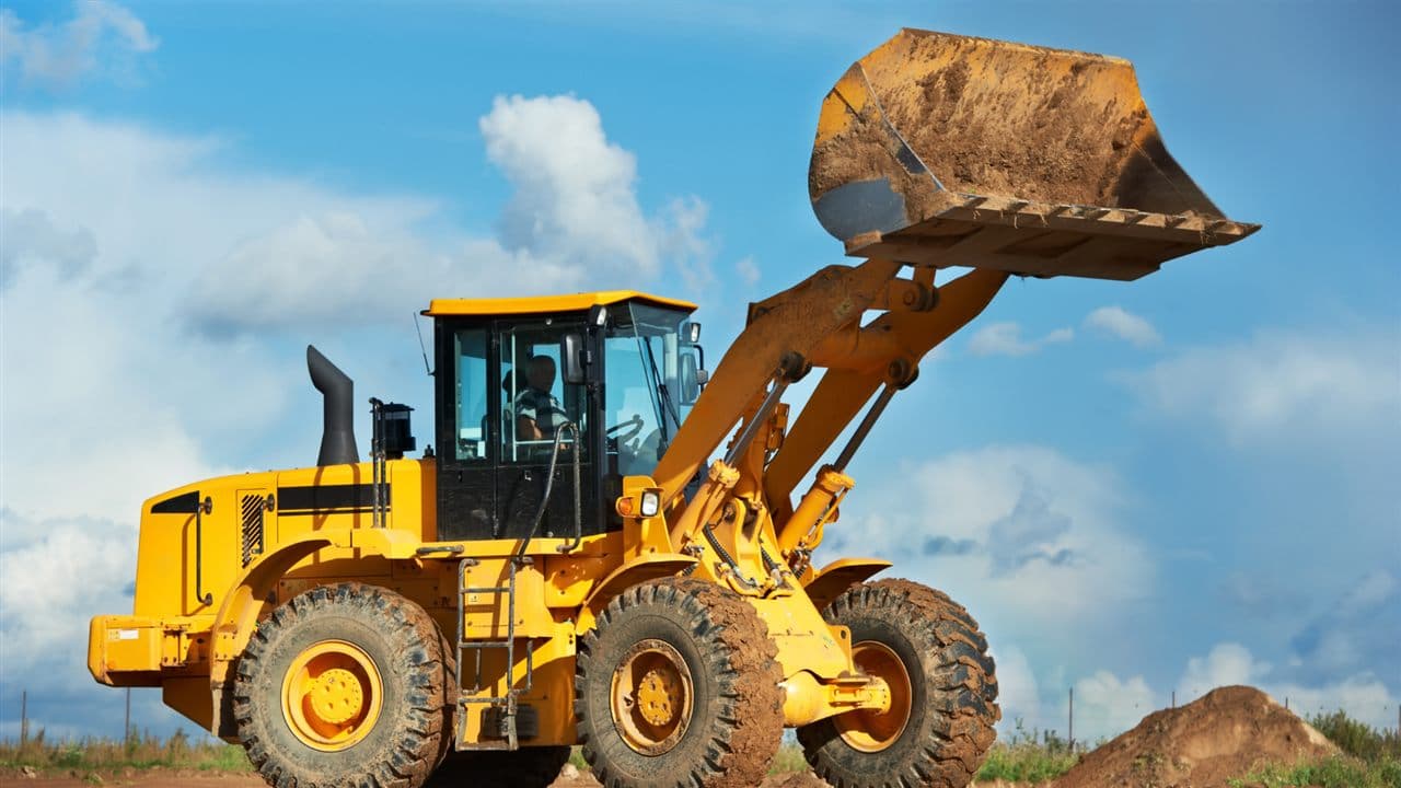 Wheel loader moving earth on a construction site