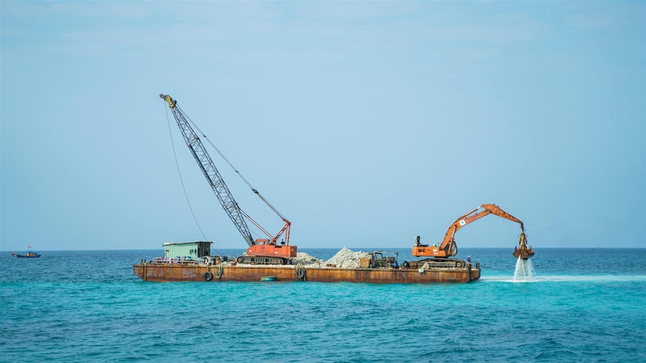 Excavator on a barge for water and marine works